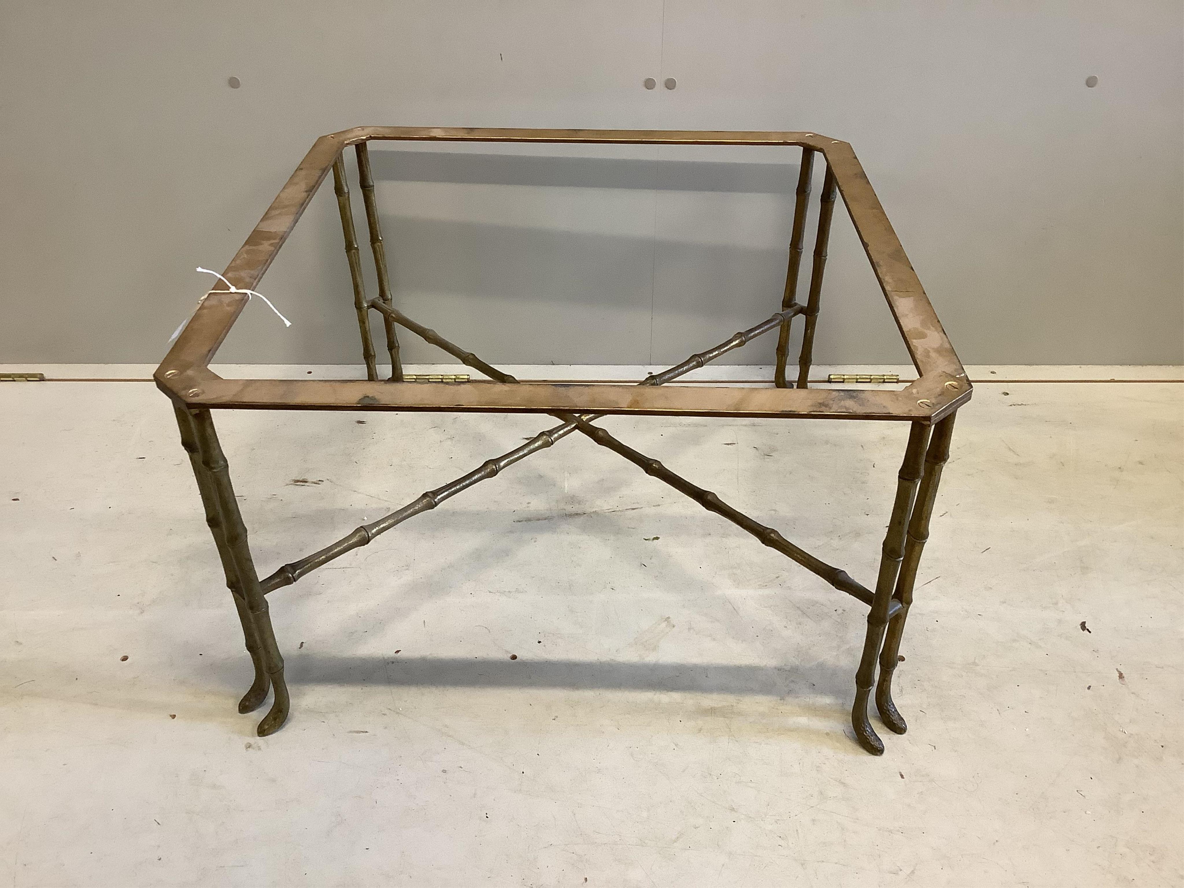 A Maison Jansen style brass and faux bamboo coffee table, lacks glass top, width 70cm, height 40cm. Condition - fair